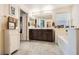 Well-lit bathroom with double vanity, a soaking tub, and tile flooring at 10316 Northern Hills Ave, Las Vegas, NV 89166