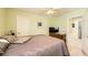 Spacious bedroom with light-green walls, carpeted flooring, and a ceiling fan at 10316 Northern Hills Ave, Las Vegas, NV 89166