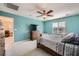 Inviting bedroom with a ceiling fan and natural light, creating a relaxing atmosphere at 10316 Northern Hills Ave, Las Vegas, NV 89166