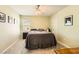 Bedroom with light green walls, a ceiling fan, and neutral-toned decor, ensuring a comfortable space at 10316 Northern Hills Ave, Las Vegas, NV 89166