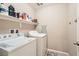 Well-organized laundry room with washer, dryer, and storage shelves at 10316 Northern Hills Ave, Las Vegas, NV 89166