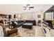 Open-concept living room featuring tile flooring and a dining area with ample natural light at 10316 Northern Hills Ave, Las Vegas, NV 89166