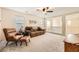 Bright upstairs living room with large windows and neutral carpet at 10316 Northern Hills Ave, Las Vegas, NV 89166