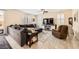 Comfortable living room with a large sectional sofa, tile floors, and plantation shutters for natural light at 10316 Northern Hills Ave, Las Vegas, NV 89166