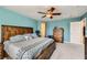 Serene main bedroom with a king-size bed, wood furnishings, and tranquil blue walls for relaxation at 10316 Northern Hills Ave, Las Vegas, NV 89166