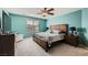 Inviting main bedroom featuring a large bed, matching nightstands, and ample natural light from the window at 10316 Northern Hills Ave, Las Vegas, NV 89166