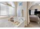 Bright bathroom with a jetted tub and bright natural light at 10638 La Spezia Way, Las Vegas, NV 89141