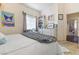 Bedroom with a fluffy rug, poster decorations, and a bright window at 10638 La Spezia Way, Las Vegas, NV 89141