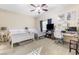 Spacious bedroom with two beds, a ceiling fan, desk and a TV at 10638 La Spezia Way, Las Vegas, NV 89141