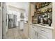 Modern kitchen with stainless steel appliances, marble countertops, and custom cabinetry at 10638 La Spezia Way, Las Vegas, NV 89141