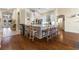 Spacious open kitchen with a central island and barstool seating and hardwood floors, perfect for hosting guests at 10638 La Spezia Way, Las Vegas, NV 89141