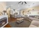 Bright living room with an open floor plan, hardwood floors, and modern kitchen features perfect for entertaining at 10638 La Spezia Way, Las Vegas, NV 89141