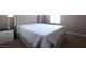 Bedroom shows a nice bed set, bedside table with lamp, and neutral walls at 10657 Blue Nile Ct, Las Vegas, NV 89144