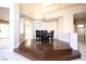 Elegant dining room with a chandelier, a wood floor, and access to other rooms at 10657 Blue Nile Ct, Las Vegas, NV 89144