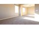 Spacious and sunlit living room features neutral paint and plush carpeting at 10657 Blue Nile Ct, Las Vegas, NV 89144