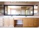Spacious main bathroom with double vanity, large mirrors, and tile floor at 10657 Blue Nile Ct, Las Vegas, NV 89144