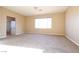 Spacious main bedroom features neutral paint, plush carpeting, and natural light at 10657 Blue Nile Ct, Las Vegas, NV 89144