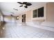 Large covered patio with tile flooring and ceiling fan for comfortable outdoor living at 10657 Blue Nile Ct, Las Vegas, NV 89144