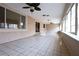 Spacious outdoor patio with tile flooring and a ceiling fan with lights at 10657 Blue Nile Ct, Las Vegas, NV 89144