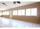 Bright sunroom with white tile flooring, many windows, and neutral walls at 10657 Blue Nile Ct, Las Vegas, NV 89144