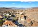 Panoramic aerial view of a desert community showcases lake and mountain views at 117 Milton Ct, Boulder City, NV 89005