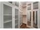 Walk-in closet featuring many built-in cabinets and shelving units at 117 Milton Ct, Boulder City, NV 89005