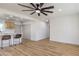 Open concept living space showcases a modern ceiling fan and connects to the kitchen at 1209 S 17Th St, Las Vegas, NV 89104