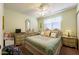 Cozy bedroom featuring a ceiling fan and complemented by vintage furnishings and pastel-colored walls at 1349 Foxglove Dr, Las Vegas, NV 89142