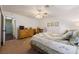 Well-lit bedroom features a ceiling fan, carpet, and three pictures on the wall at 1349 Foxglove Dr, Las Vegas, NV 89142