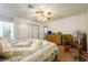 Bright bedroom features a ceiling fan, sliding closet door, exercise bike and cozy carpet at 1349 Foxglove Dr, Las Vegas, NV 89142