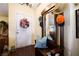 Charming entryway features a hall tree with mirror and decorative wreath on the front door at 1349 Foxglove Dr, Las Vegas, NV 89142