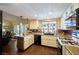 Open kitchen with white cabinets, stainless steel appliances, and a view into the living area at 1349 Foxglove Dr, Las Vegas, NV 89142