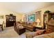 Open living room with traditional furnishings and a view of the lush outdoors at 1349 Foxglove Dr, Las Vegas, NV 89142