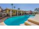 Enjoy this pool with a tanning ledge, palm trees, shade, and lovely tile at 1349 Foxglove Dr, Las Vegas, NV 89142