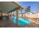 Backyard pool offers tanning ledge, shade, and patio space for relaxing and entertaining friends at 1349 Foxglove Dr, Las Vegas, NV 89142