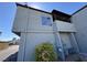 Exterior shot of a two story home with a small balcony and stucco facade under a clear blue sky at 1460 Hialeah Dr # D, Las Vegas, NV 89119