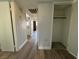 Hallway with closet, wood floors, and doorway leading to the kitchen, offering seamless transition between spaces at 1460 Hialeah Dr # D, Las Vegas, NV 89119