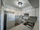 Updated kitchen featuring white cabinets, white appliances, and stainless steel sink at 1460 Hialeah Dr # D, Las Vegas, NV 89119