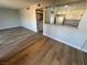 Open concept living room with wood flooring adjacent to the kitchen at 1460 Hialeah Dr # D, Las Vegas, NV 89119