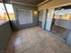 Private tiled patio featuring sliding glass doors and natural light at 1460 Hialeah Dr # D, Las Vegas, NV 89119