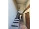 Stairwell with tile flooring, concrete steps, and access to covered parking at 1460 Hialeah Dr # D, Las Vegas, NV 89119