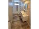 Updated bathroom with modern vanity, chrome fixtures and tiled shower at 1642 Palma Vista Ave, Las Vegas, NV 89169