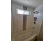 Modern bathroom features tiled shower with glass and decorative tile at 1642 Palma Vista Ave, Las Vegas, NV 89169
