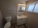 Clean bathroom with modern vanity, new faucet, and a framed mirror at 1642 Palma Vista Ave, Las Vegas, NV 89169