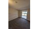 A cozy bedroom features natural light, neutral walls, and carpet at 1642 Palma Vista Ave, Las Vegas, NV 89169