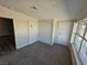 Bedroom with carpet, sliding closet, and windows allowing ample natural light at 1642 Palma Vista Ave, Las Vegas, NV 89169