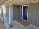 Inviting front porch features a blue front door and stylish tiled entryway at 1642 Palma Vista Ave, Las Vegas, NV 89169