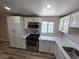 Bright kitchen features white cabinets, stainless steel appliances, and a window at 1642 Palma Vista Ave, Las Vegas, NV 89169