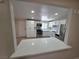 Open kitchen view with stainless steel appliances and white cabinets, showcasing its modern design at 1642 Palma Vista Ave, Las Vegas, NV 89169