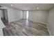 Large, well-lit living room with hardwood floors and neutral walls create a welcoming atmosphere at 1642 Palma Vista Ave, Las Vegas, NV 89169
